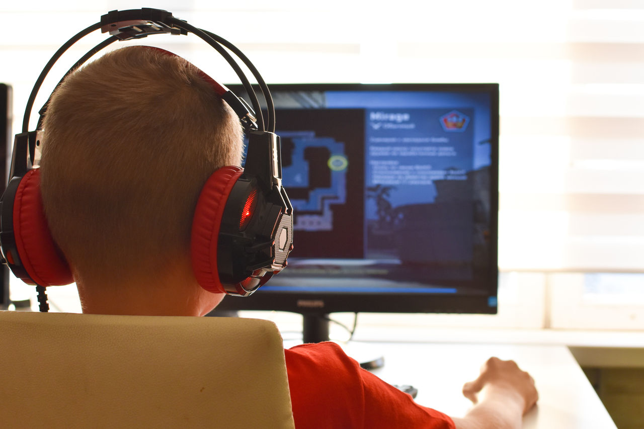 online learning. boy is playing an online game on  internet. children's gambling addiction.,online learning. boy is playing an online game on  internet. chi